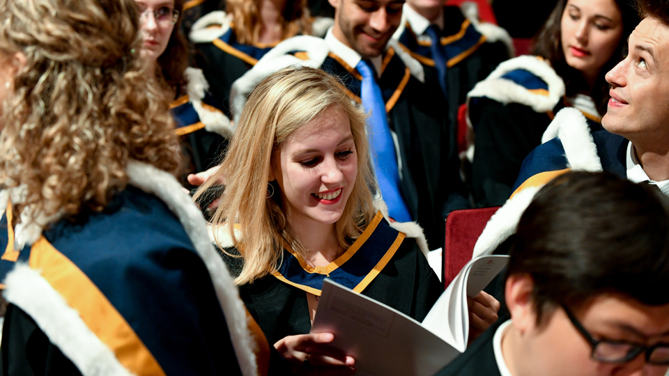 RCM graduand reading programme in graduation ceremony